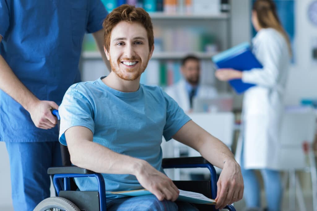Young Chicago man smiles as he prepares for spasticity treatment after a stroke